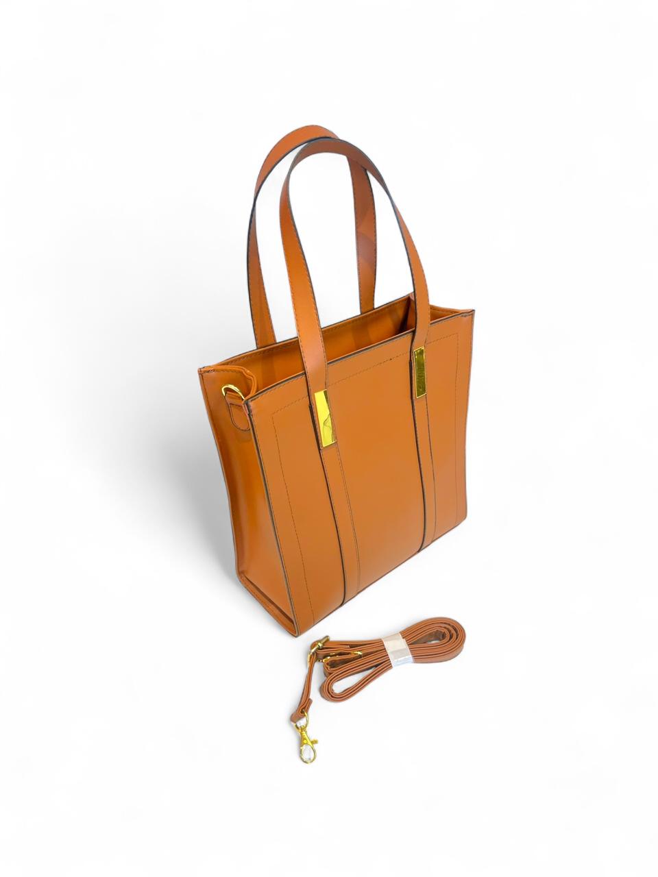 Bolso premium estructurado en color camel con detalles dorados, correa desmontable y compartimentos internos que lo hacen ideal para oficina, reuniones o uso diario elegante.