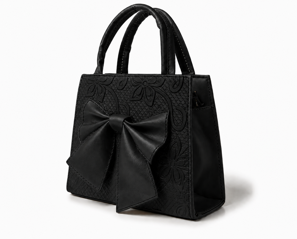 MAGNOLIA - Bolsa mini de doble asa con moño al frente y delicado grabado floral.