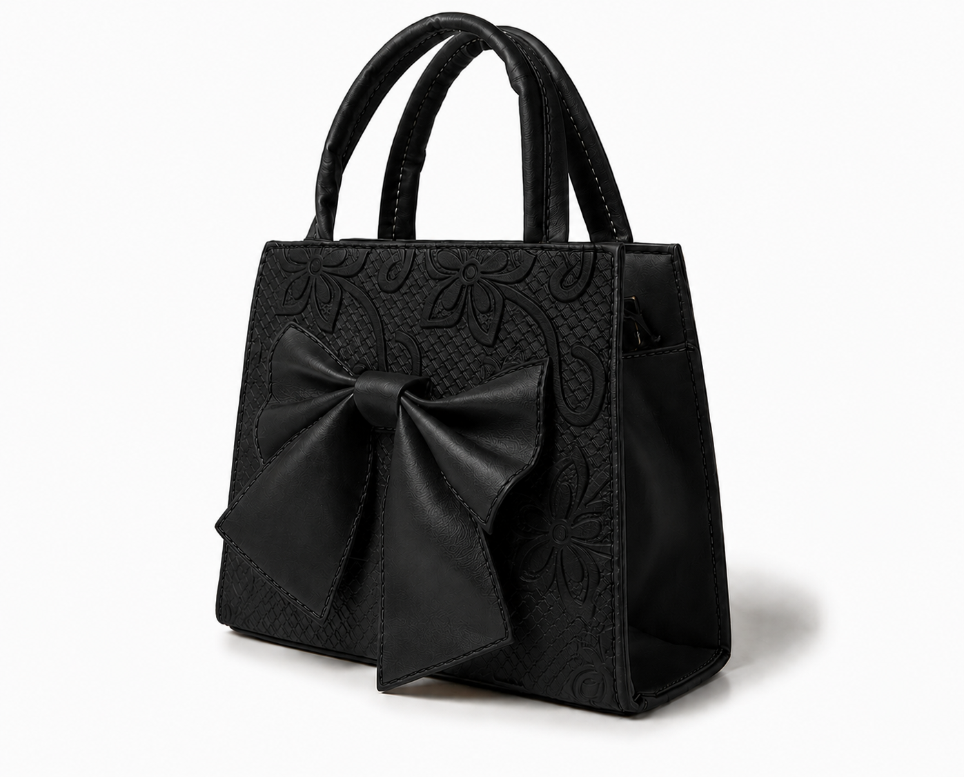MAGNOLIA - Bolsa mini de doble asa con moño al frente y delicado grabado floral.