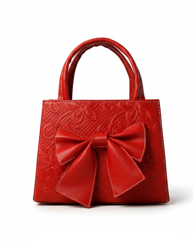 MAGNOLIA - Bolsa mini de doble asa con moño al frente y delicado grabado floral.