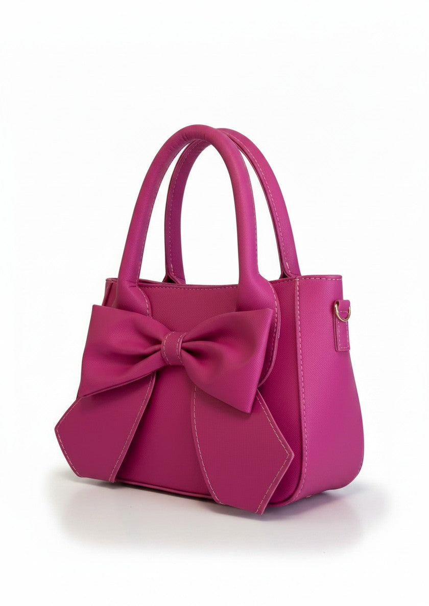 Bolsa mini mujer fuchsia con moño oversize frontal, asas rígidas y correa desmontable – DALALI